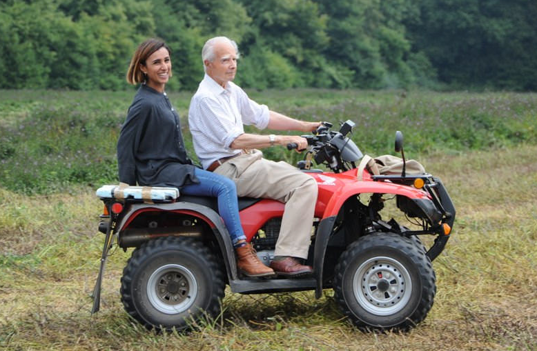 Sir Michael shows Anita the farm where our famous Peppermint Oil is made.